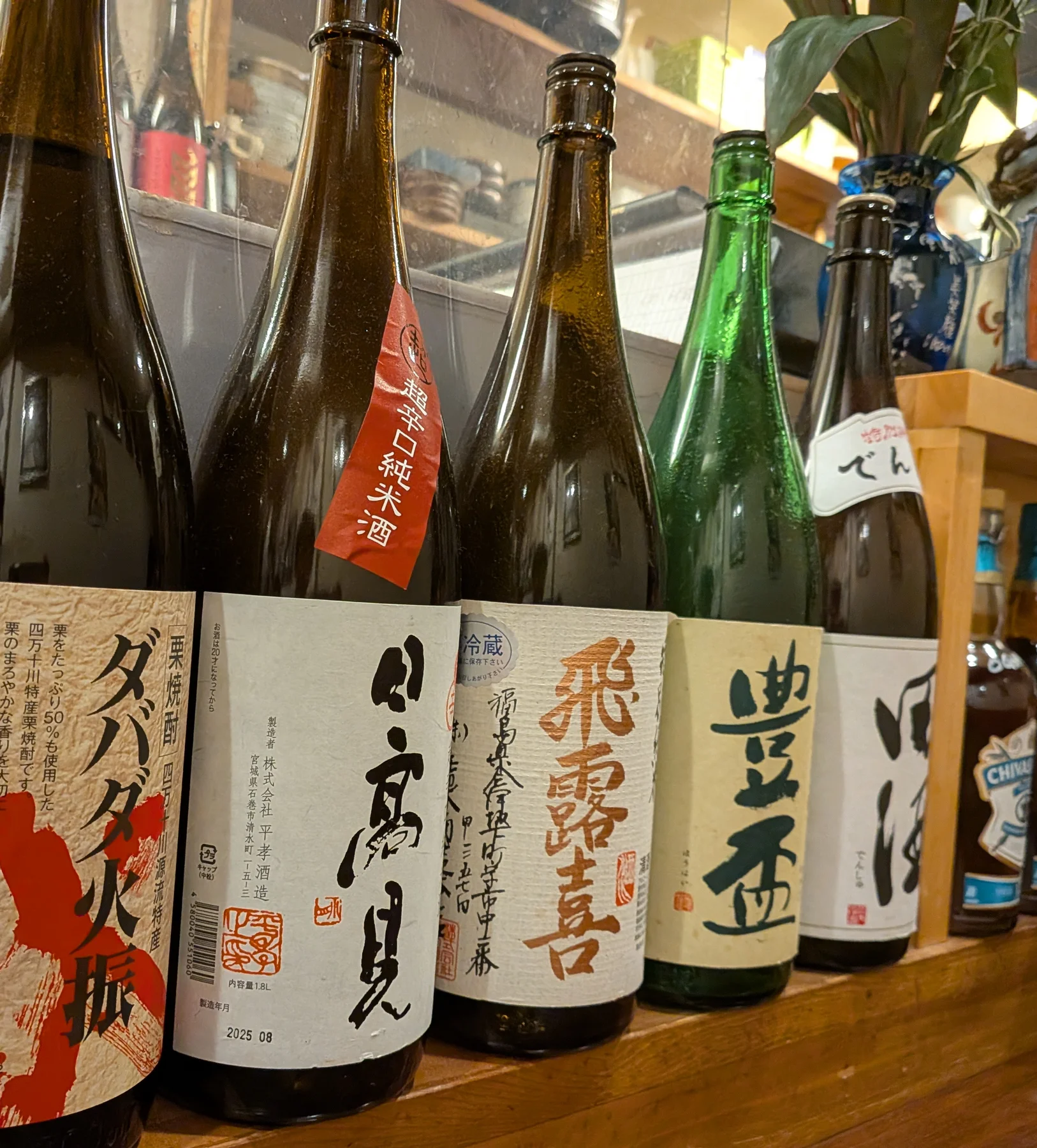 Sake bottles lined up inside Chigusa in Shinjuku