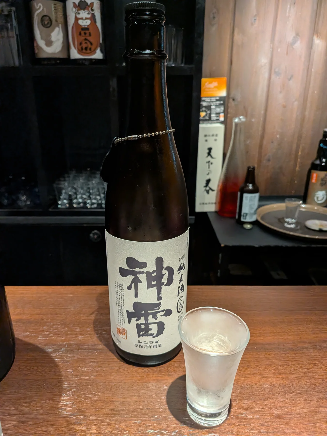 Shinrai White Label Junmai bottle and glass at Kuri in Ginza