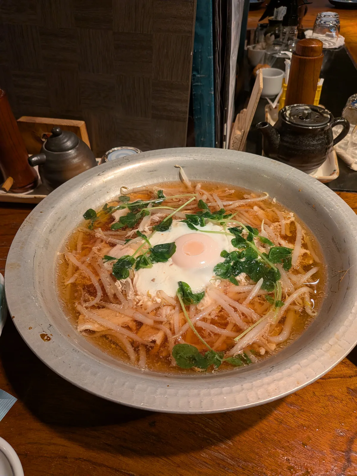 Dashi-based nikudofu with pork, tofu, bean sprouts, and egg at Sakana-ya